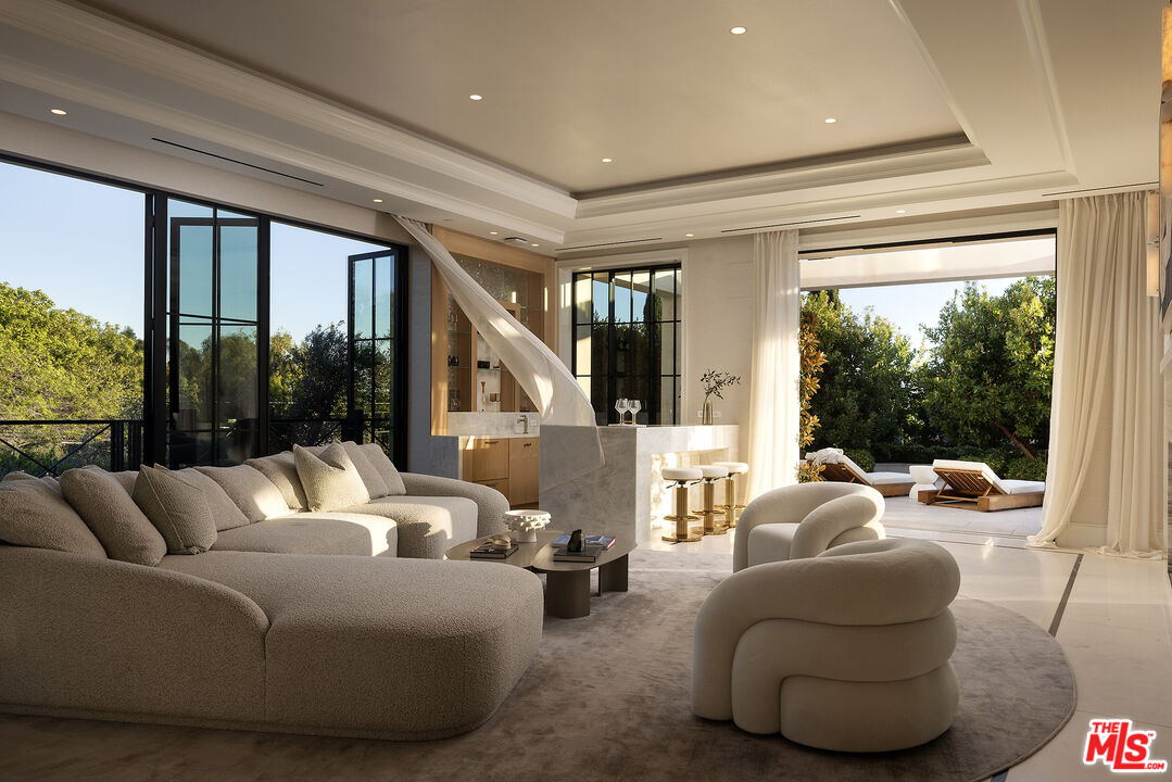 721 North Bonhill Road Los Angeles, CA 90049 - Photo 7 of 64 a living room with furniture and a large window