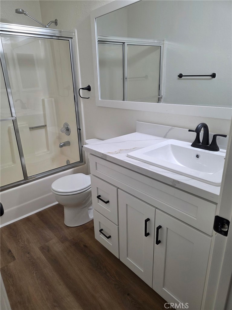 12590 Cobalt Road Victorville, CA 92392 - Photo 25 of 37 a bathroom with a sink a toilet and a mirror