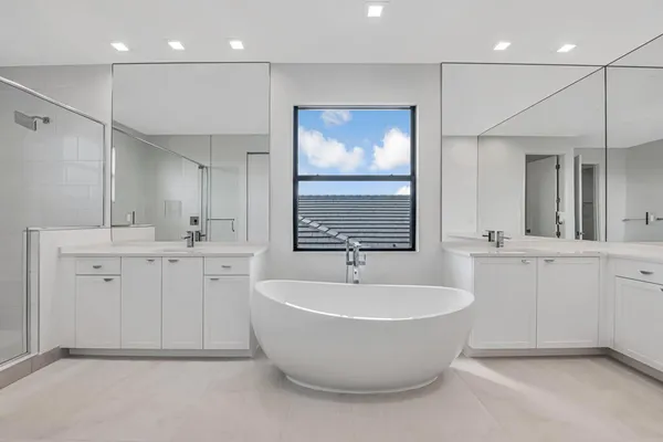 a bathroom with a granite countertop sink a toilet and shower
