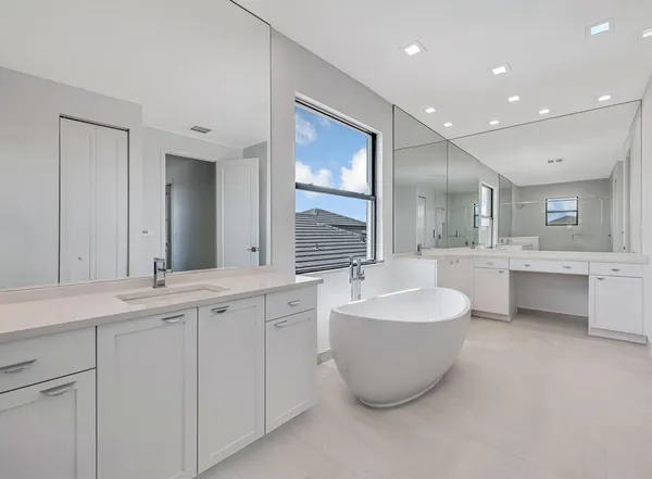 a bathroom with a sink toilet and a mirror