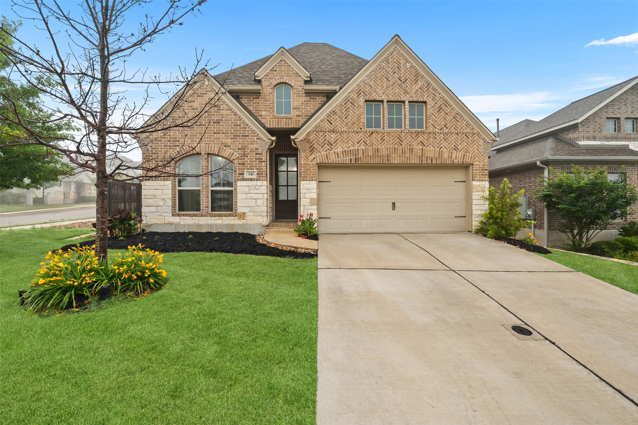 341 Pisa Lane Georgetown, TX 78628 - Photo 1 of 31 a front view of a house with garden