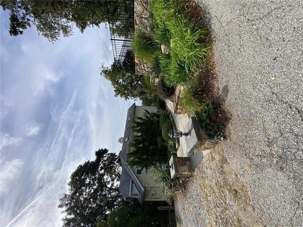 49 Croton Point Avenue, Unit C Croton-on-Hudson, NY 10520 - Photo 11 of 17 a view of a backyard with sitting area