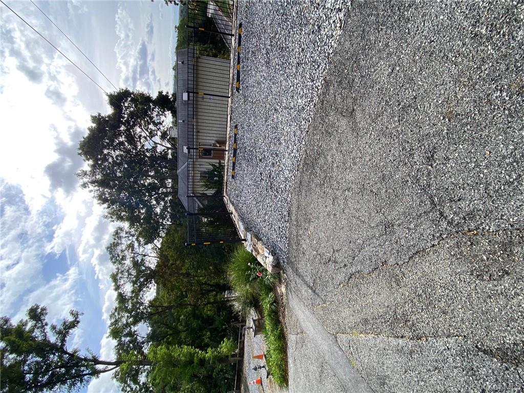 49 Croton Point Avenue, Unit C Croton-on-Hudson, NY 10520 - Photo 13 of 17 a view of a backyard with plants