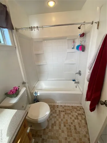 a bathroom with a sink toilet and mirror