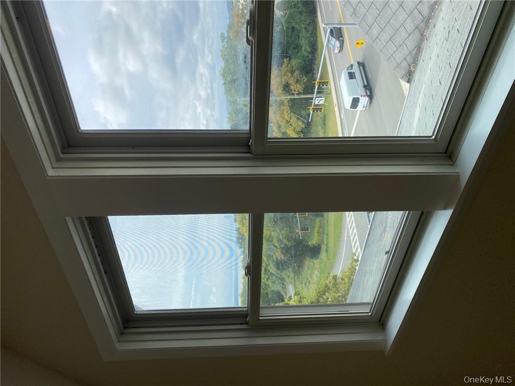 49 Croton Point Avenue, Unit C Croton-on-Hudson, NY 10520 - Photo 4 of 17 a view of a glass door with a from a window