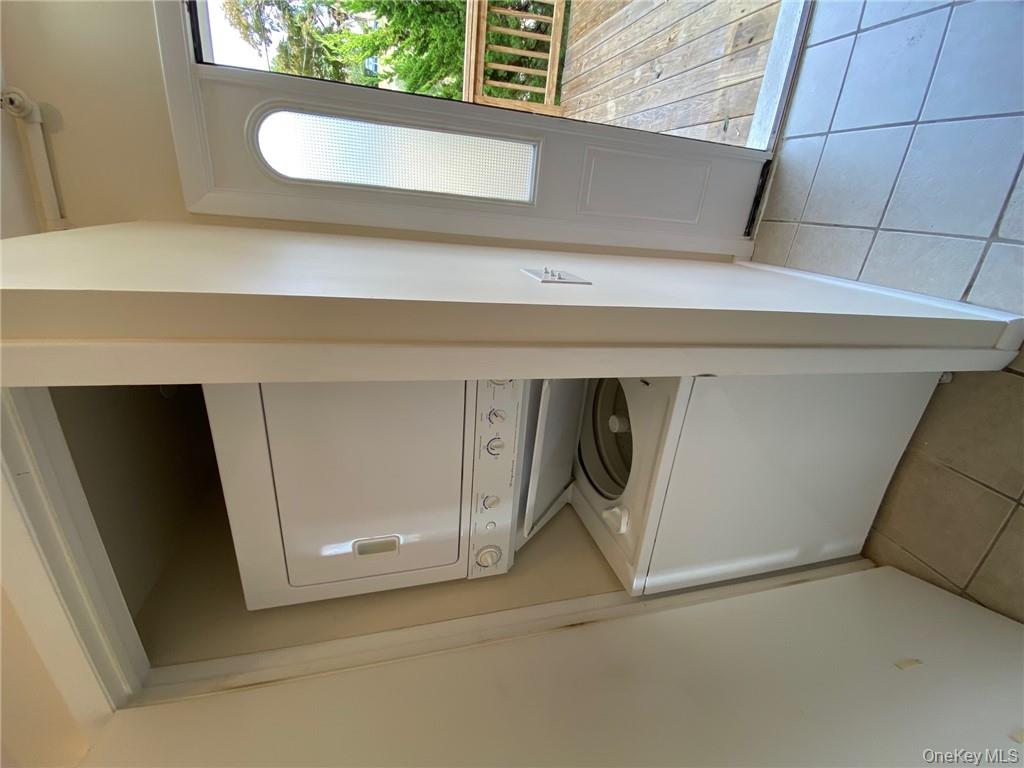 49 Croton Point Avenue, Unit C Croton-on-Hudson, NY 10520 - Photo 7 of 17 a utility room with dryer and washer