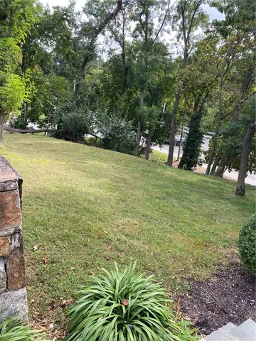 a view of a backyard with sitting area