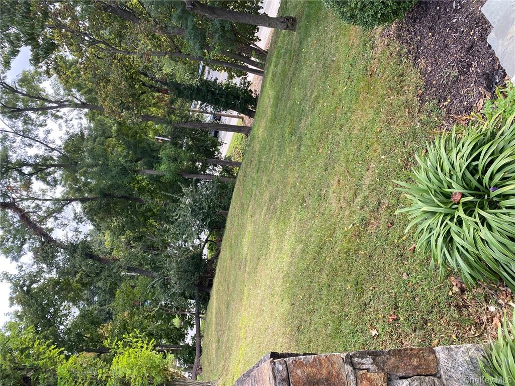 49 Croton Point Avenue, Unit C Croton-on-Hudson, NY 10520 - Photo 10 of 17 a view of a yard with a house
