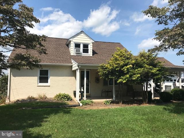 561 Georgetown Road Ronks, PA 17572 - Photo 1 of 34 a front view of a house with a yard and garage