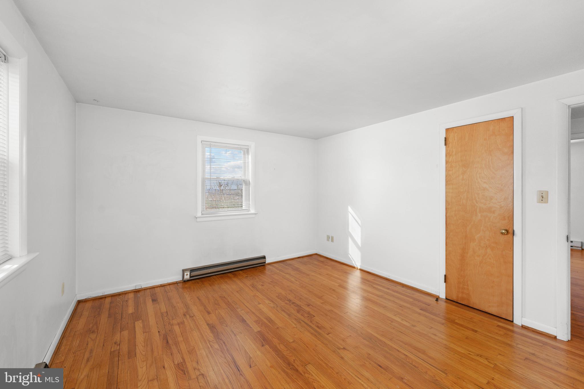 561 Georgetown Road Ronks, PA 17572 - Photo 11 of 34 an empty room with wooden floor and windows