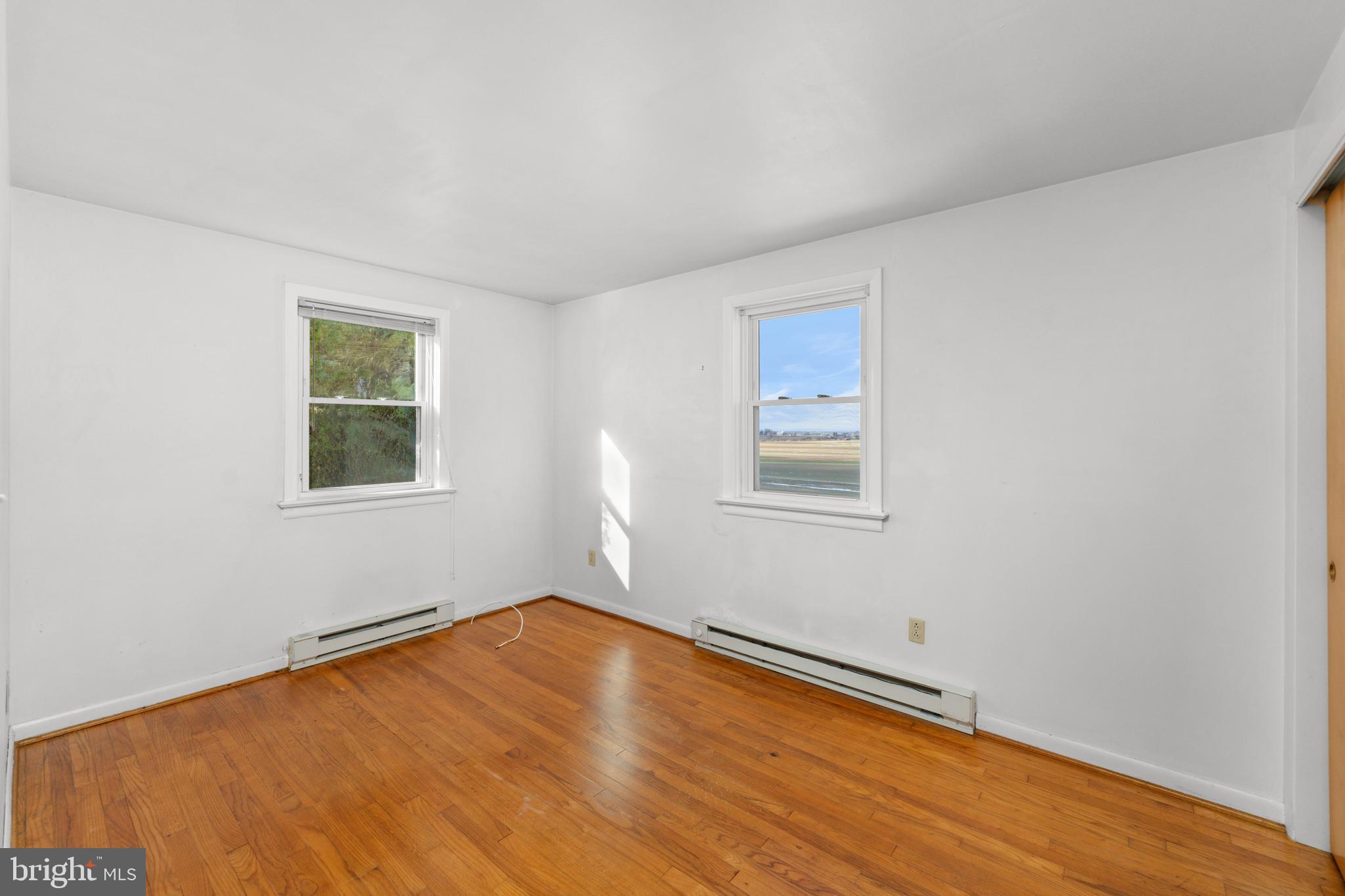 561 Georgetown Road Ronks, PA 17572 - Photo 12 of 34 a view of a room with wooden floor and window