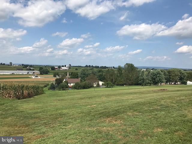 561 Georgetown Road Ronks, PA 17572 - Photo 2 of 34 a view of a lake with houses in the back