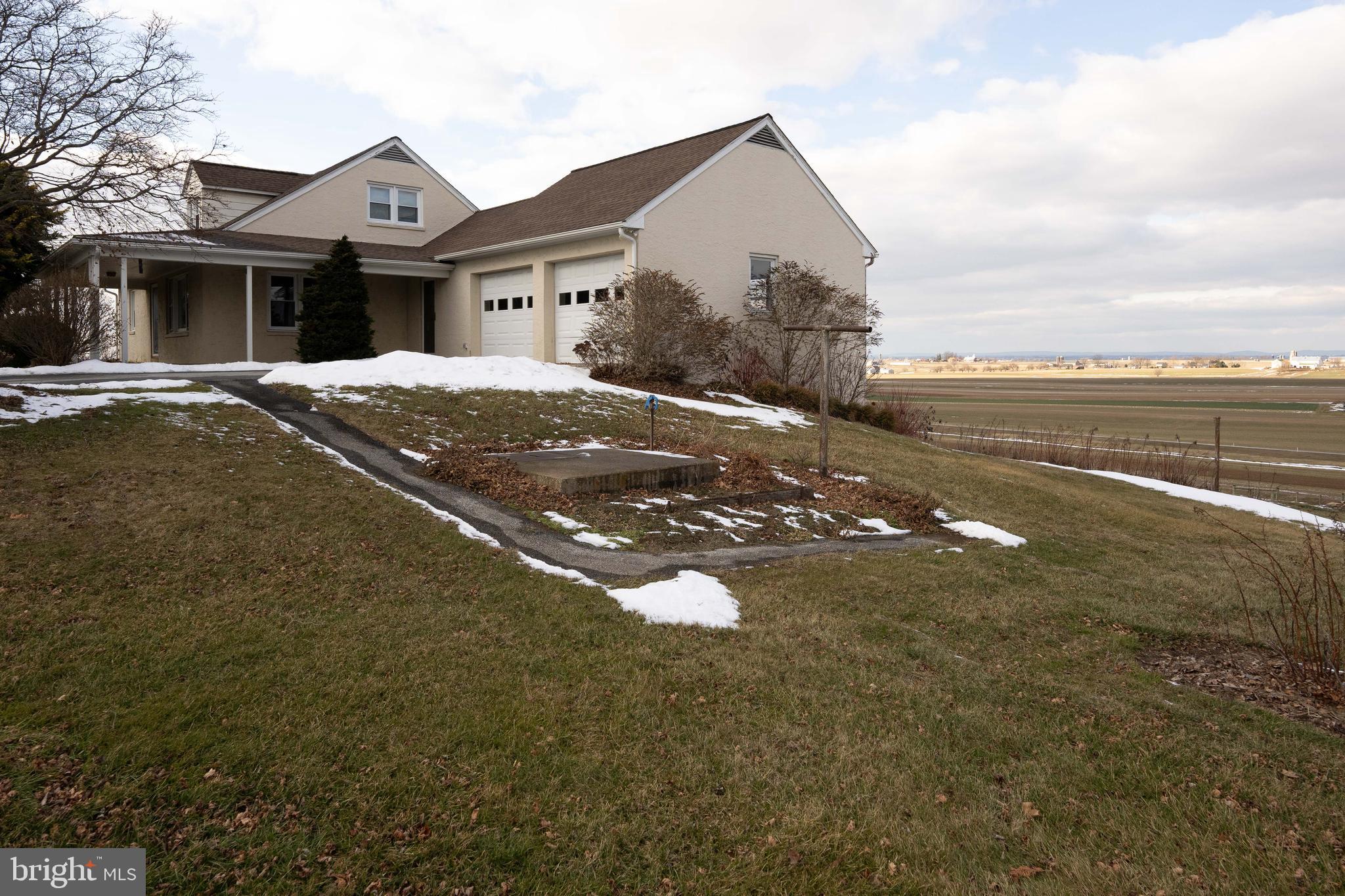 561 Georgetown Road Ronks, PA 17572 - Photo 26 of 34 a front view of a house with a yard and lake view