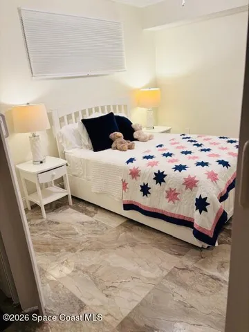 a living room with a couch and a window