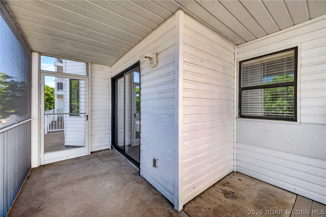 1111 Passover Road, Unit N1 Osage Beach, MO 65065 - Photo 51 of 57 Concrete covered screened porch.