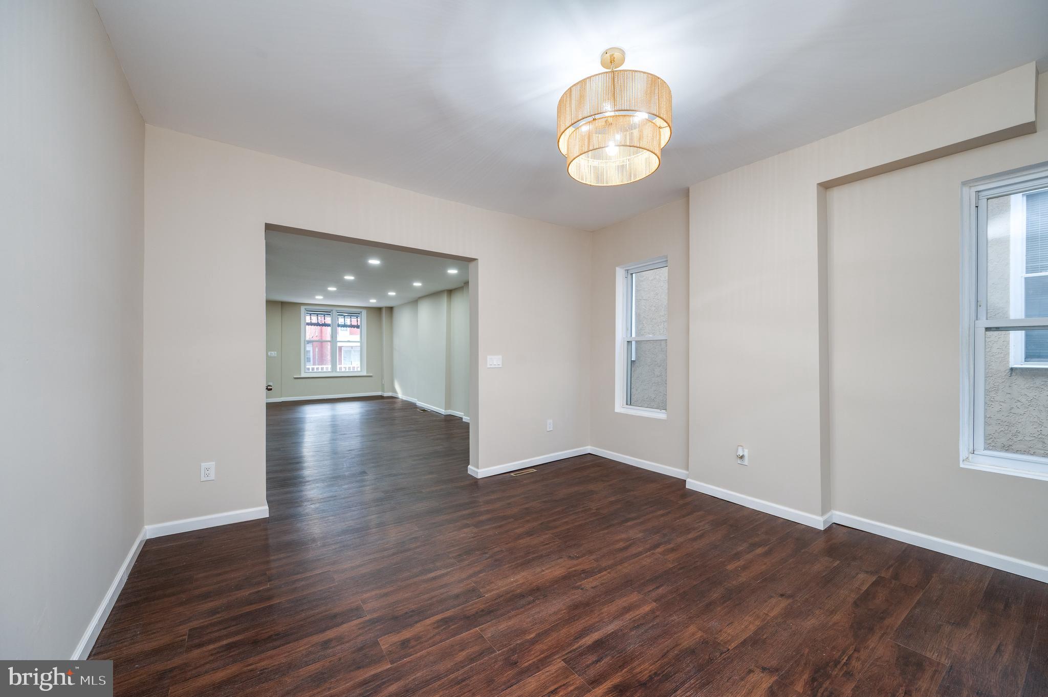137 Elm Street Reading, PA 19601 - Photo 16 of 49 an empty room with wooden floor and windows