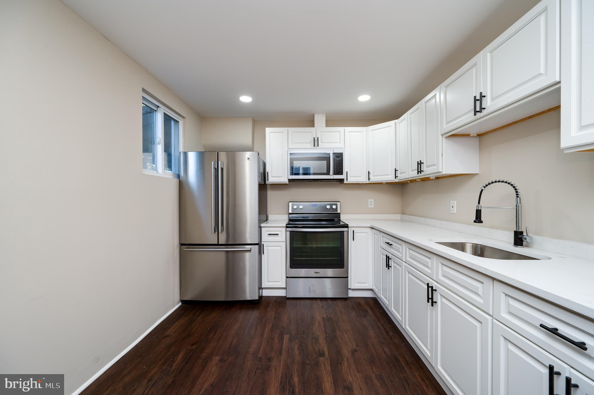 137 Elm Street Reading, PA 19601 - Photo 18 of 49 a kitchen with stainless steel appliances a refrigerator sink and cabinets