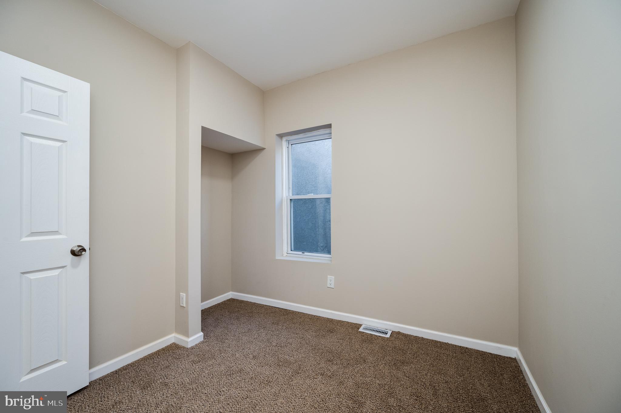 137 Elm Street Reading, PA 19601 - Photo 24 of 49 an empty room with a window