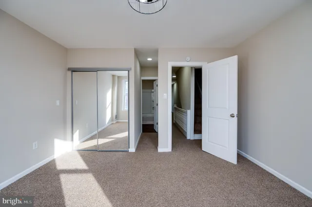 a white bath tub sitting next to a white sink and vanity