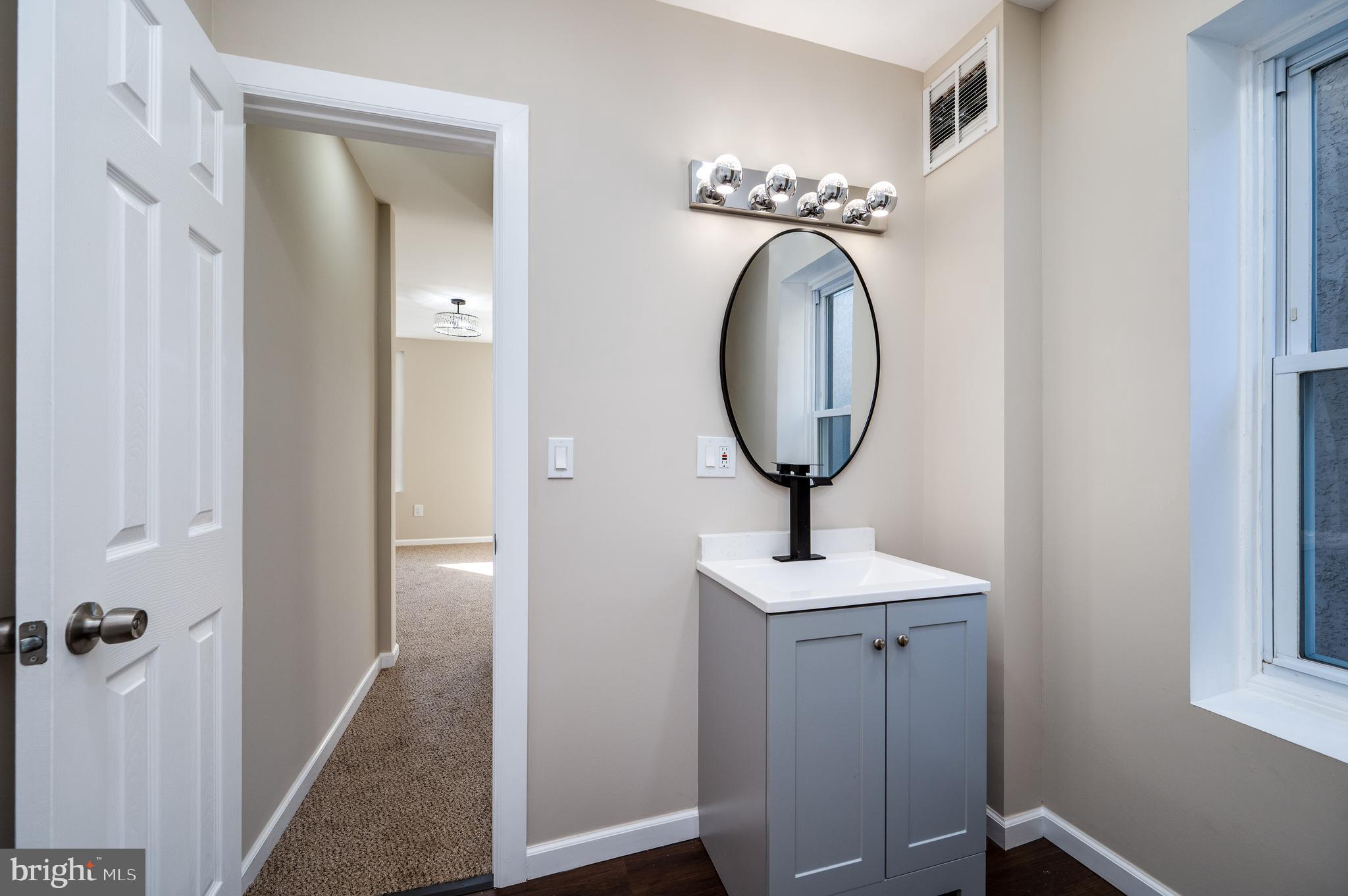 137 Elm Street Reading, PA 19601 - Photo 30 of 49 a bathroom with a sink and a mirror