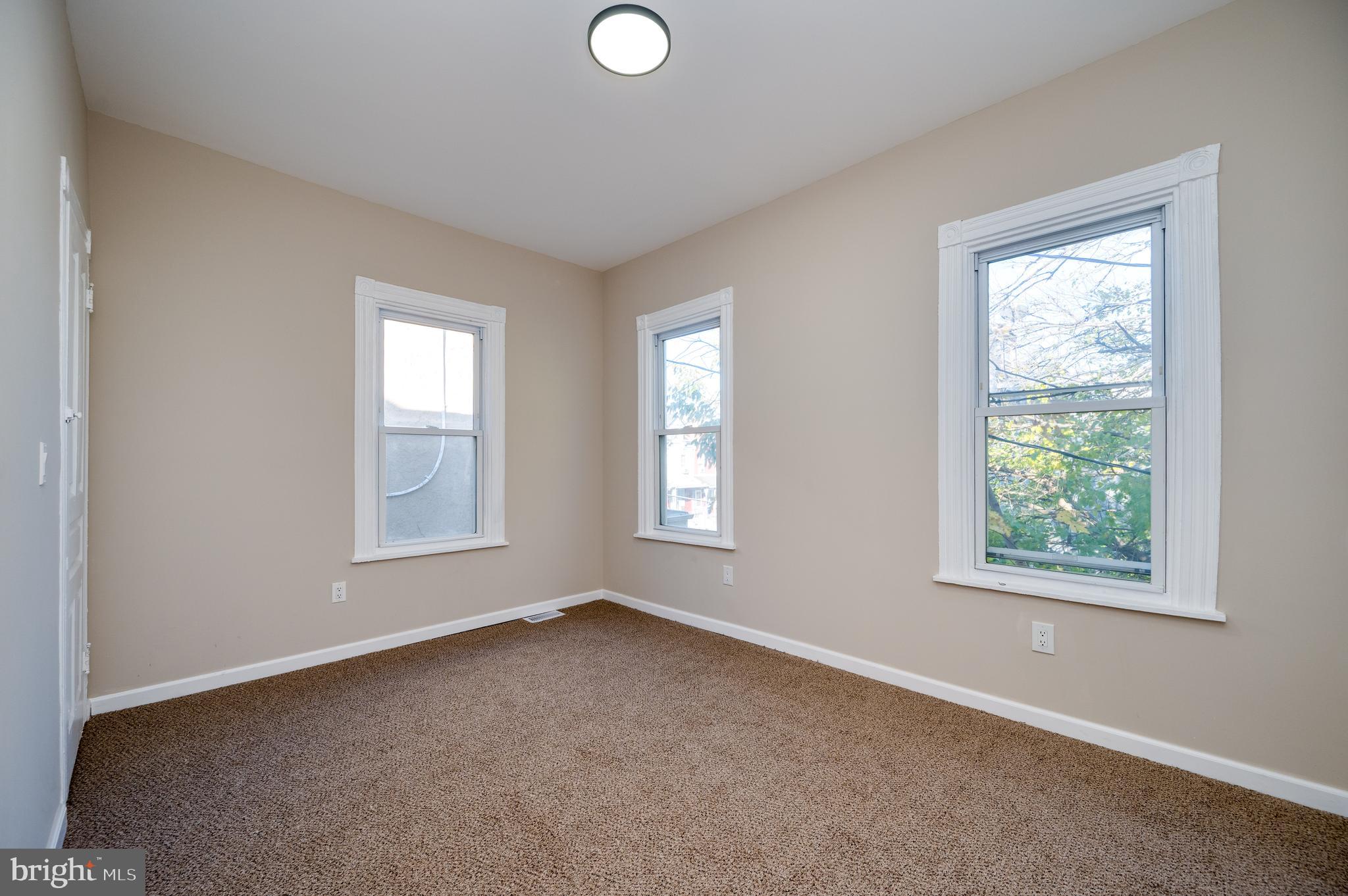 137 Elm Street Reading, PA 19601 - Photo 33 of 49 a view of an empty room with a window