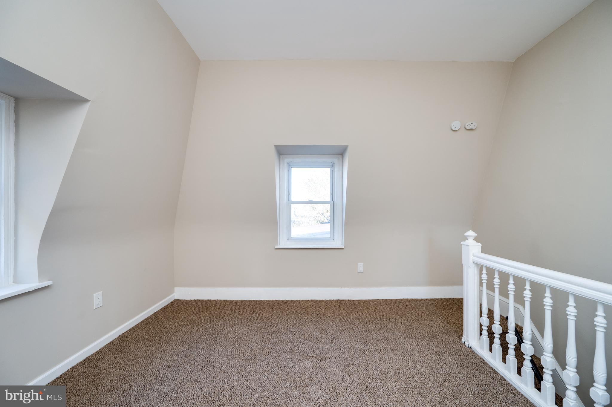 137 Elm Street Reading, PA 19601 - Photo 35 of 49 a view of an empty room with a window
