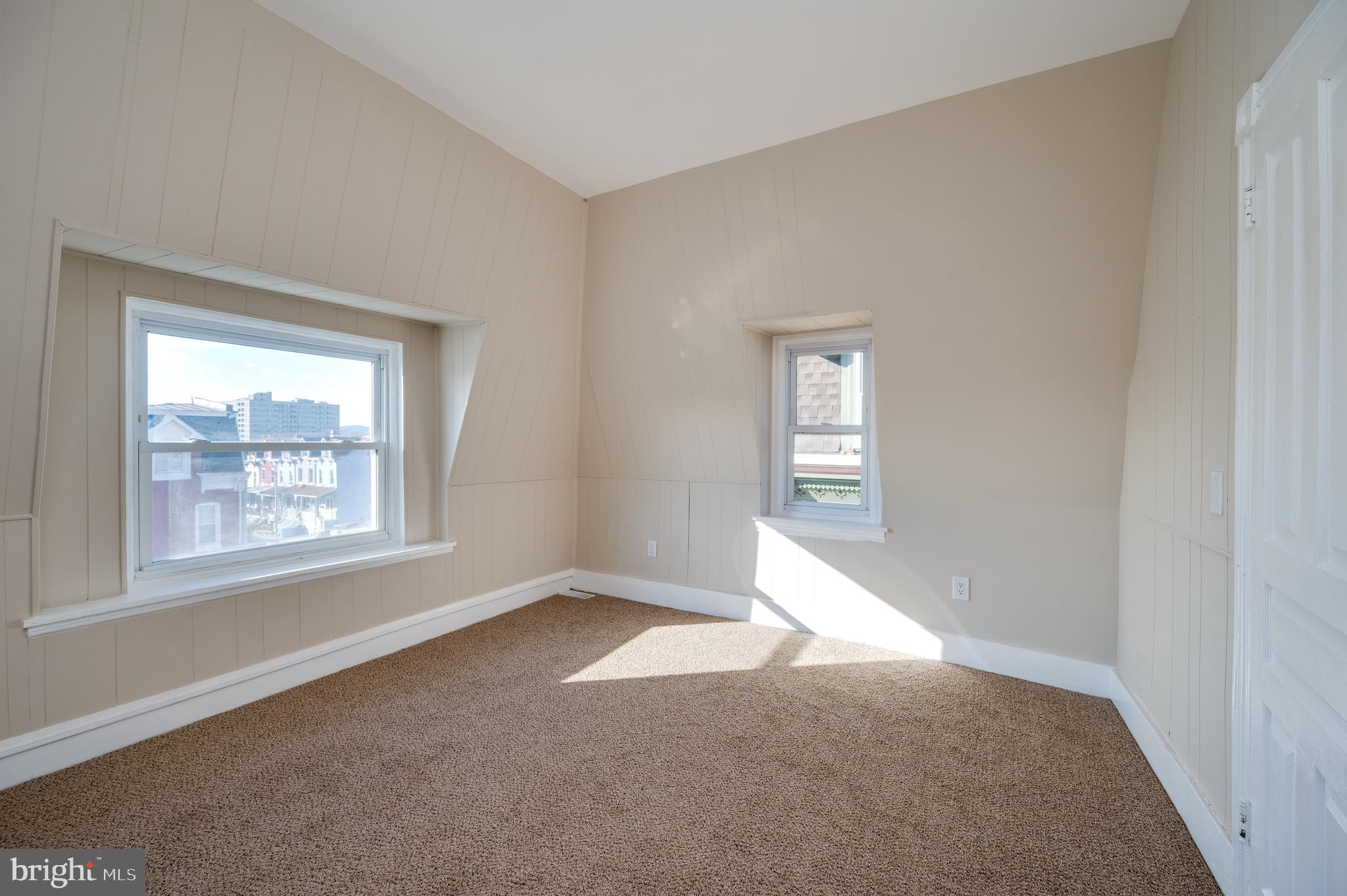 137 Elm Street Reading, PA 19601 - Photo 40 of 49 a view of an empty room with a window
