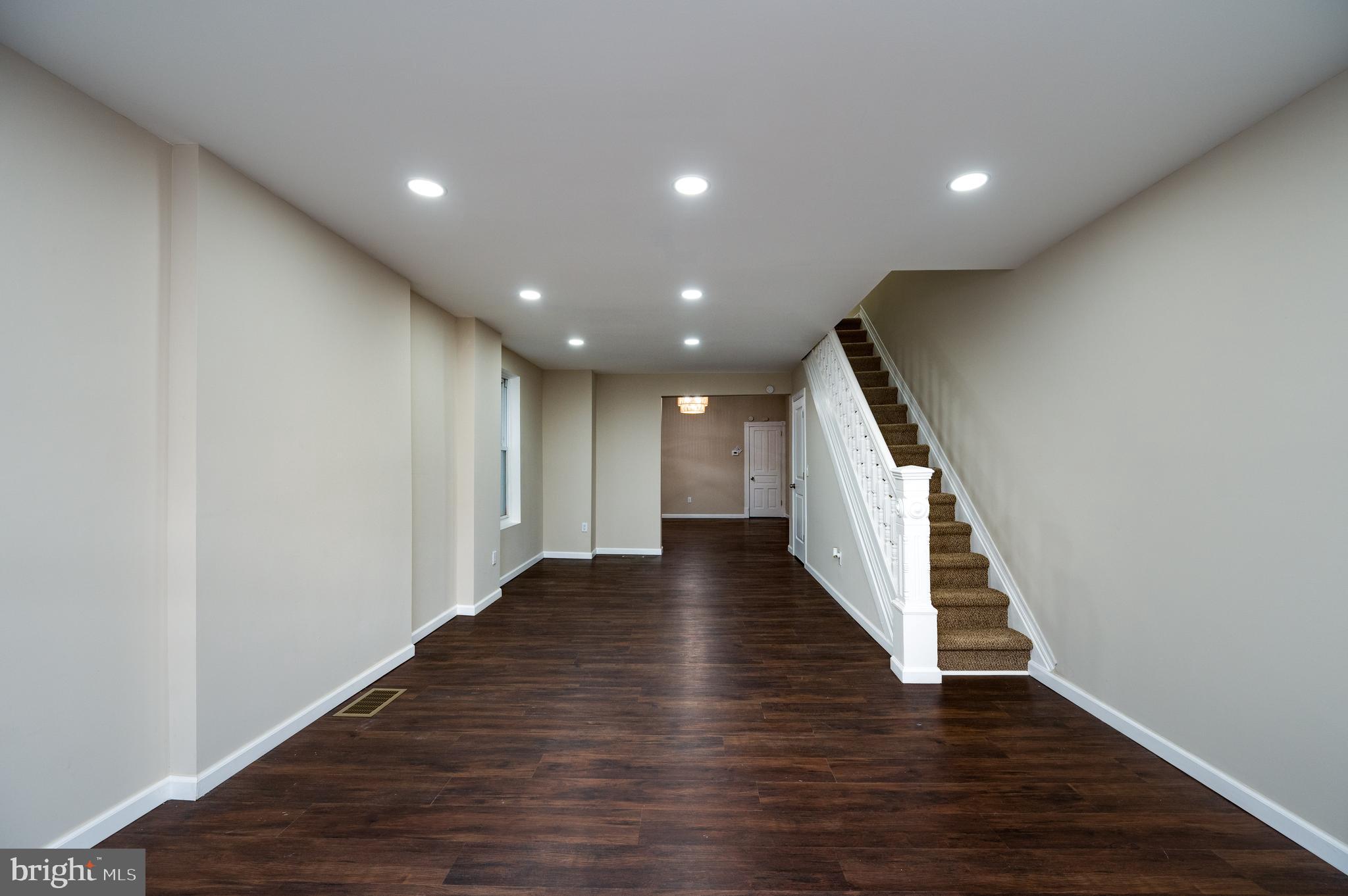 137 Elm Street Reading, PA 19601 - Photo 7 of 49 a view of a hallway with wooden floor