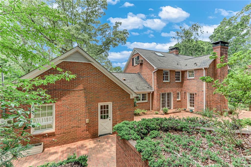 2626 Club Drive Gainesville, GA 30506 - Photo 11 of 71 a front view of a house with a yard and potted plants