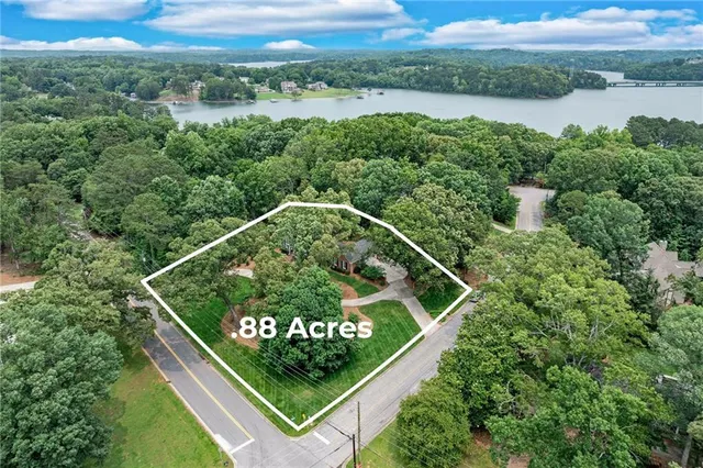 an aerial view of residential house with outdoor space and lake view