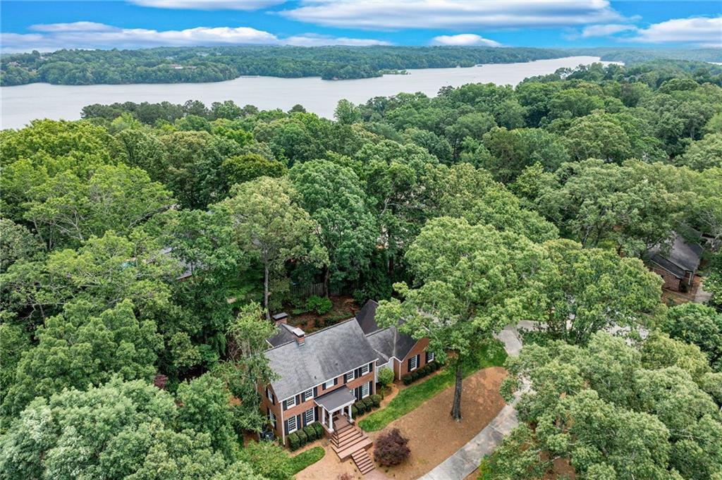2626 Club Drive Gainesville, GA 30506 - Photo 14 of 71 an aerial view of a house with a yard and lake view