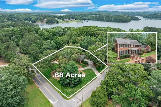a front view of a house with yard and green space