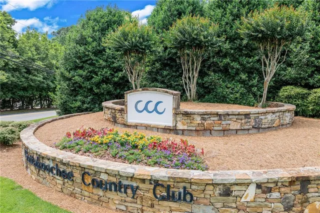 a view of a livingroom with furniture and a window