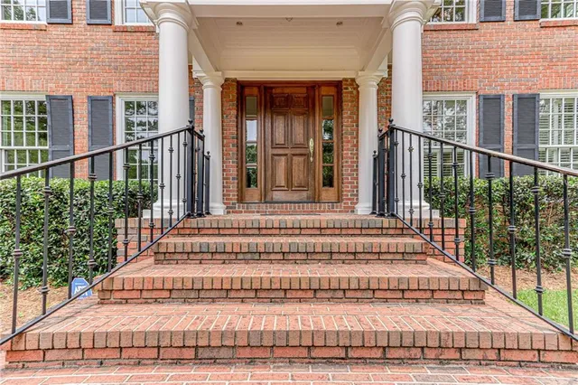 a view of room with furniture and wooden floor