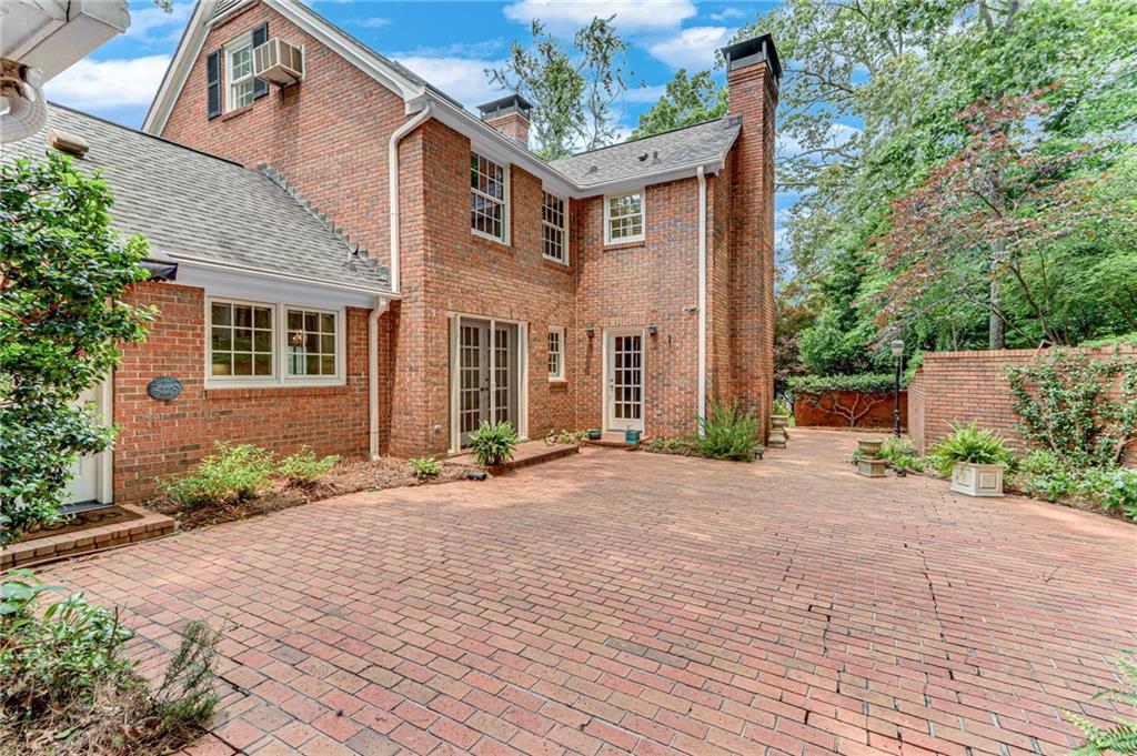 2626 Club Drive Gainesville, GA 30506 - Photo 28 of 71 a front view of a house with a yard and potted plants