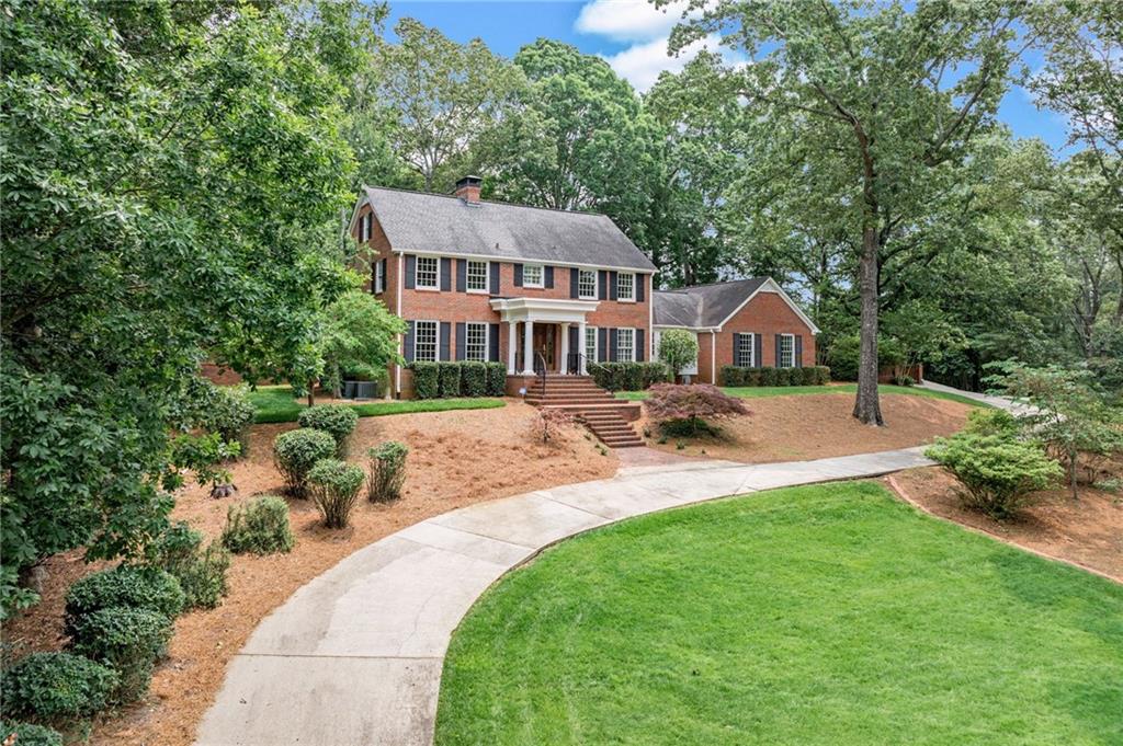 2626 Club Drive Gainesville, GA 30506 - Photo 3 of 71 a front view of a house with yard and green space