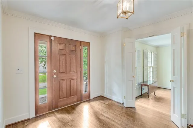 a large kitchen with stainless steel appliances kitchen island a large counter top and a stove top oven