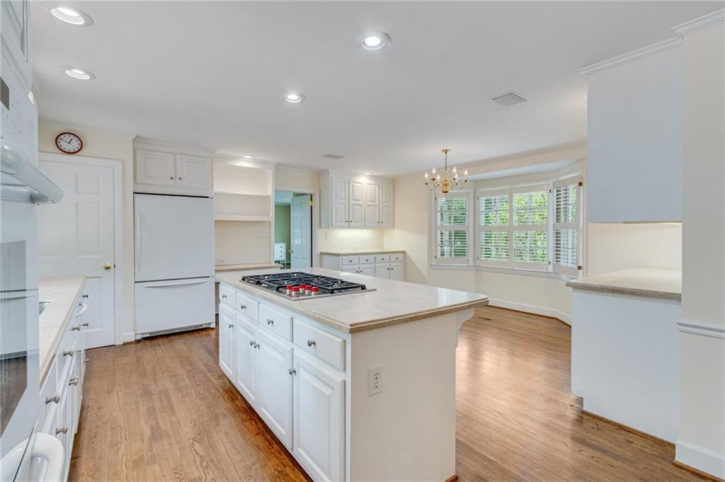 2626 Club Drive Gainesville, GA 30506 - Photo 45 of 71 a kitchen with a stove a sink and wooden floor