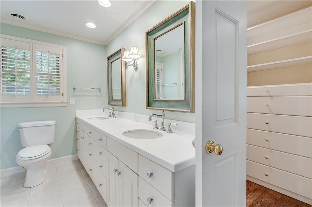 2626 Club Drive Gainesville, GA 30506 - Photo 60 of 71 a bathroom with a toilet sink and mirror