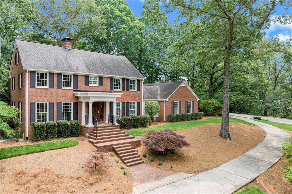 2626 Club Drive Gainesville, GA 30506 - Photo 9 of 71 a front view of a house with garden