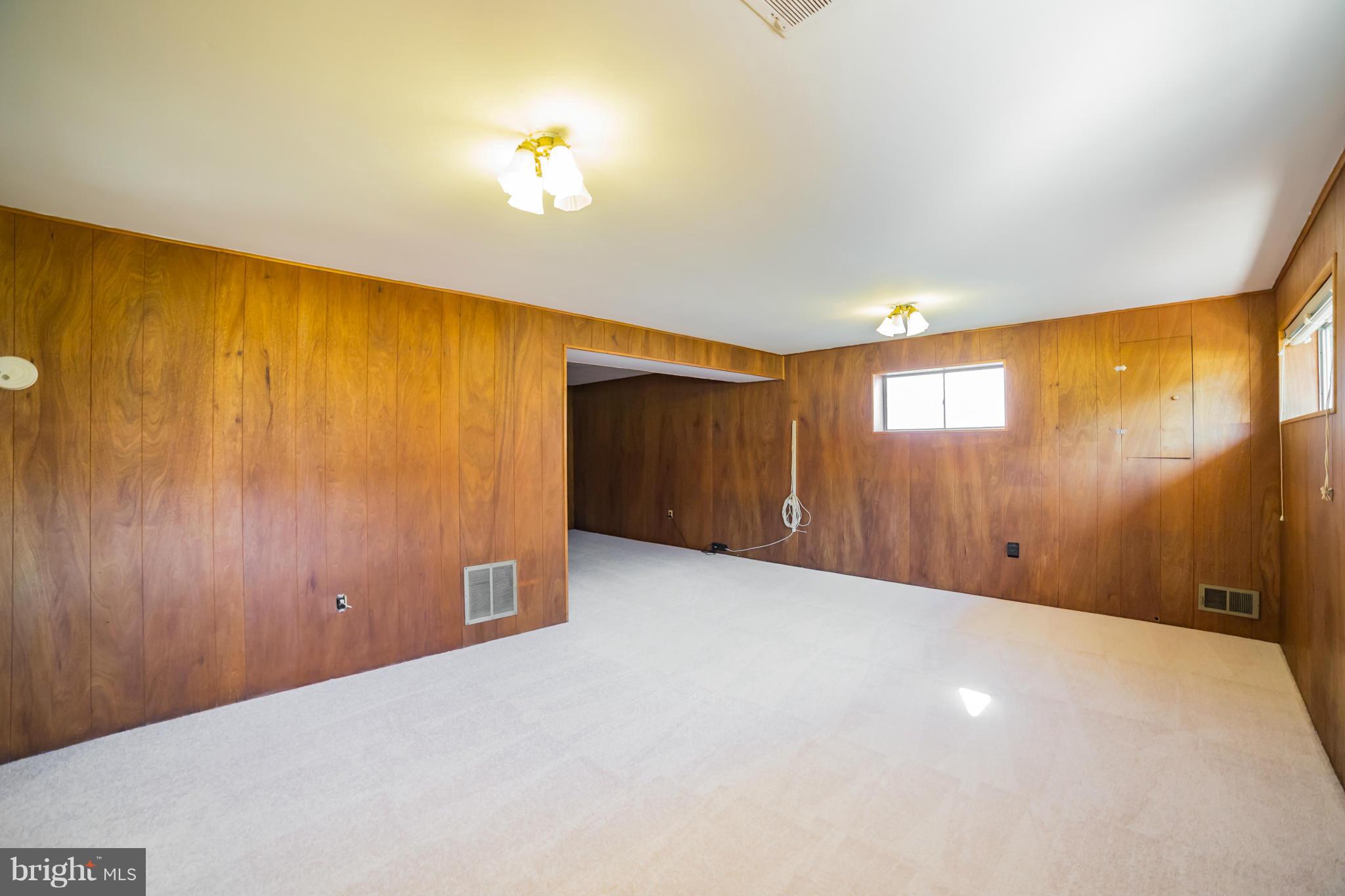 11608 Gilsan Street Silver Spring, MD 20902 - Photo 19 of 28 Cozy recreation room with brand new carpeting