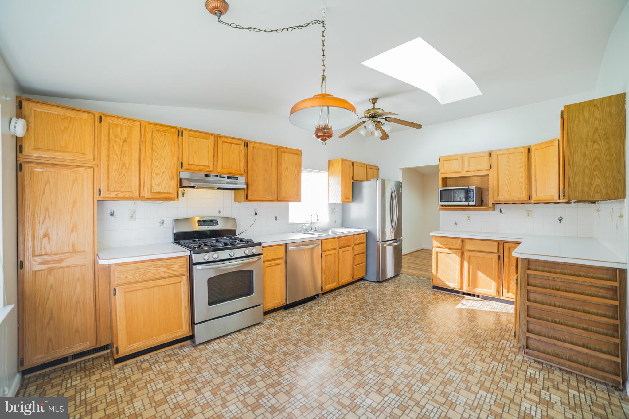 11608 Gilsan Street Silver Spring, MD 20902 - Photo 4 of 28 Updated kitchen with vaulted ceiling and skylight