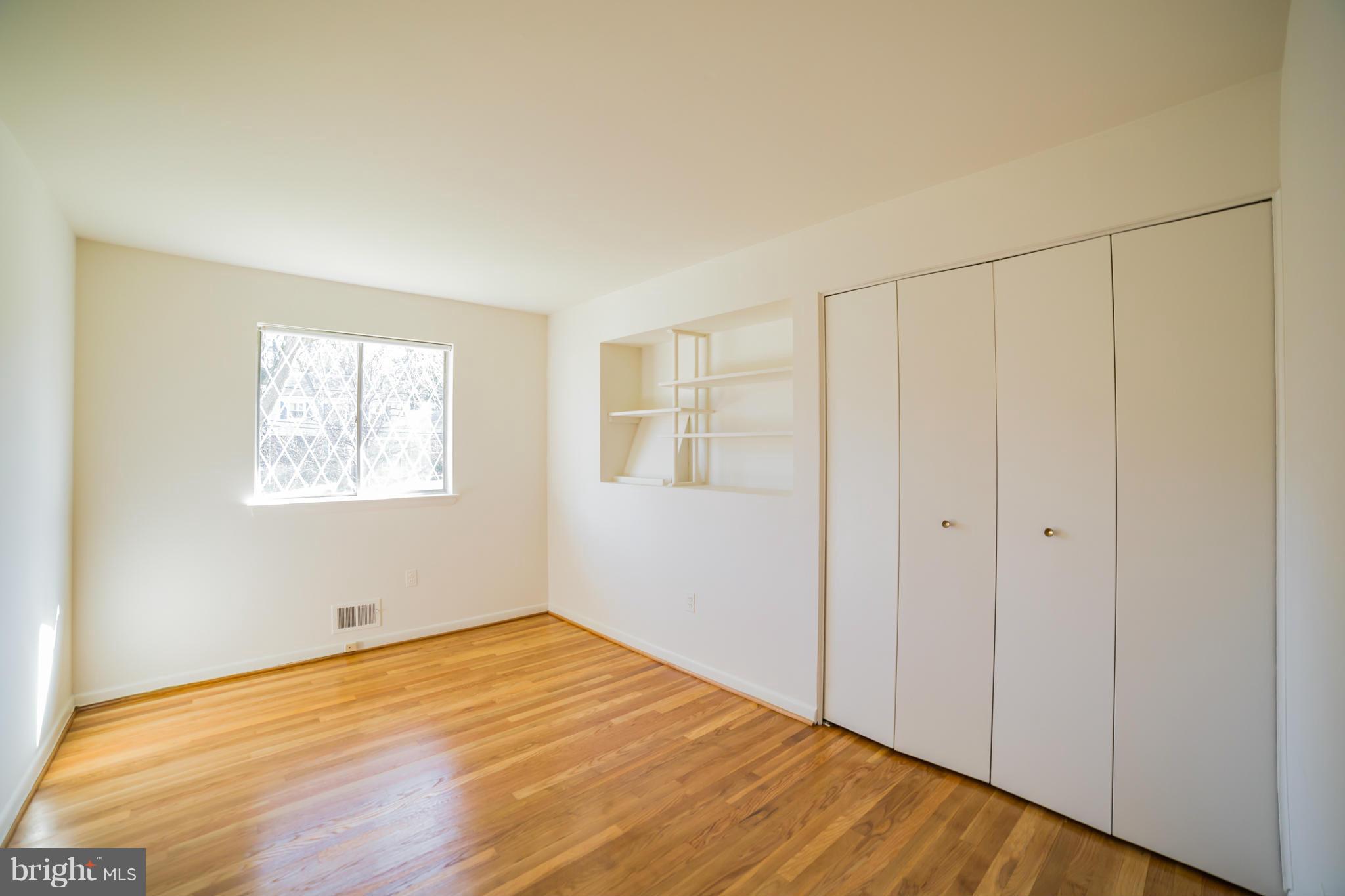 11608 Gilsan Street Silver Spring, MD 20902 - Photo 10 of 28 Bedroom 2 - built in bookshelves