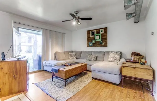 a living room with furniture and a table