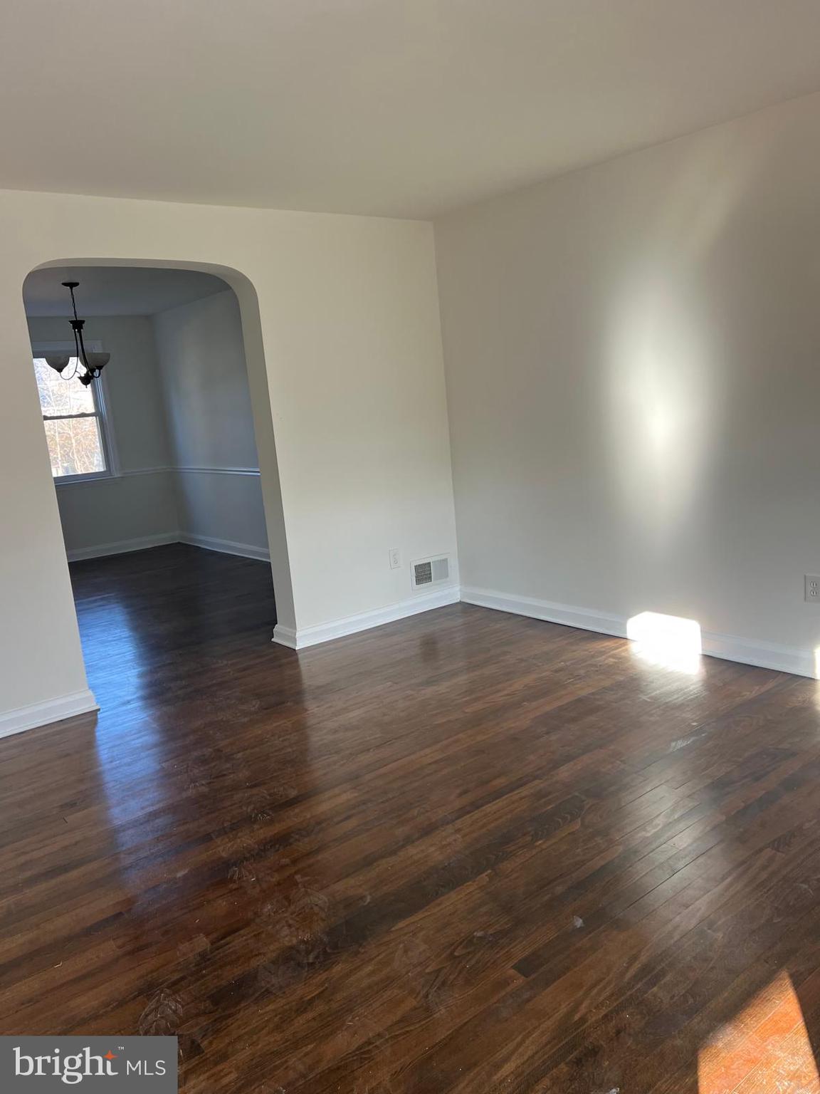603 Braeside Road Baltimore, MD 21229 - Photo 11 of 30 a view of empty room with wooden floor