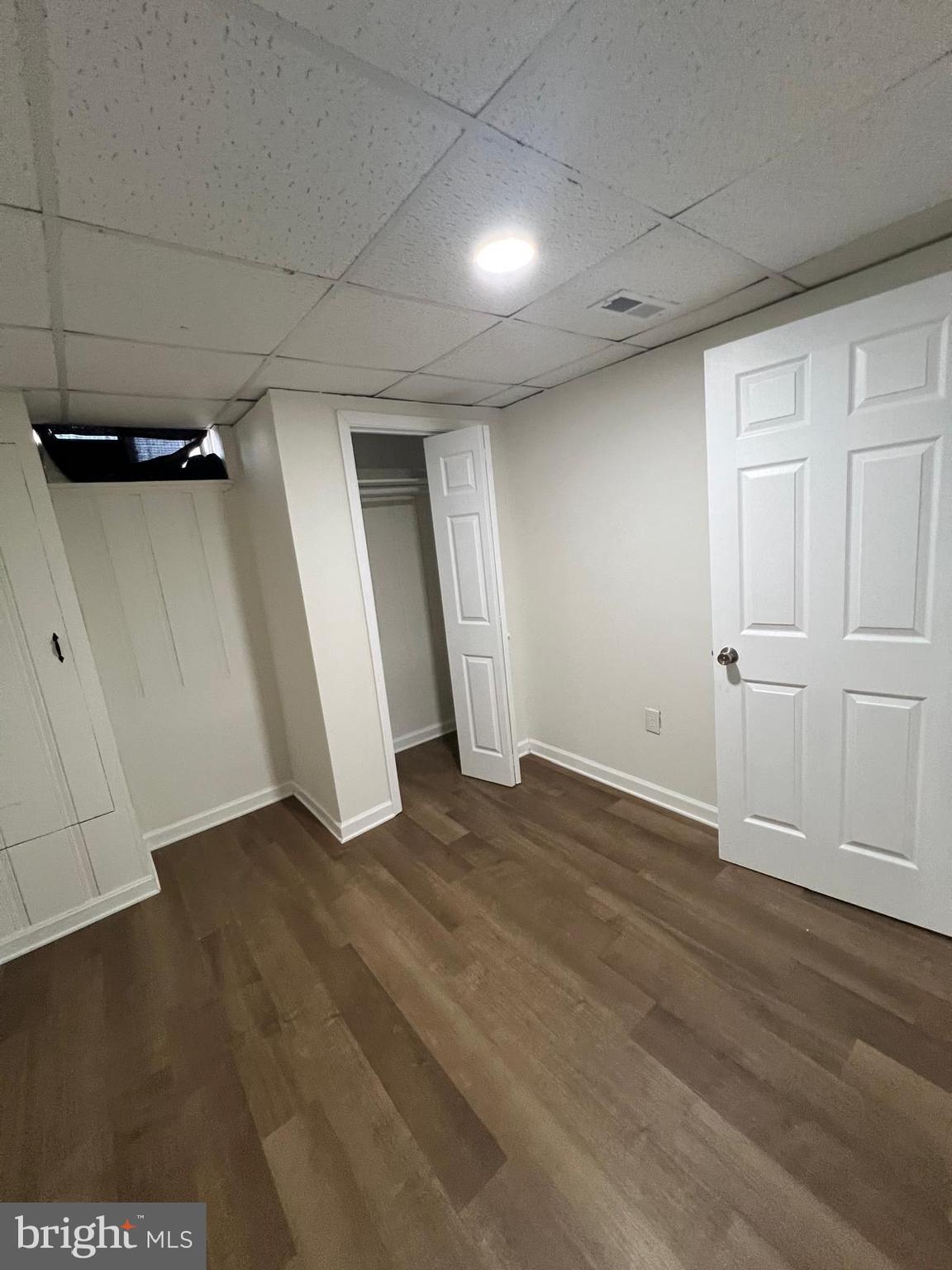 603 Braeside Road Baltimore, MD 21229 - Photo 13 of 30 an empty room with wooden floor and closet