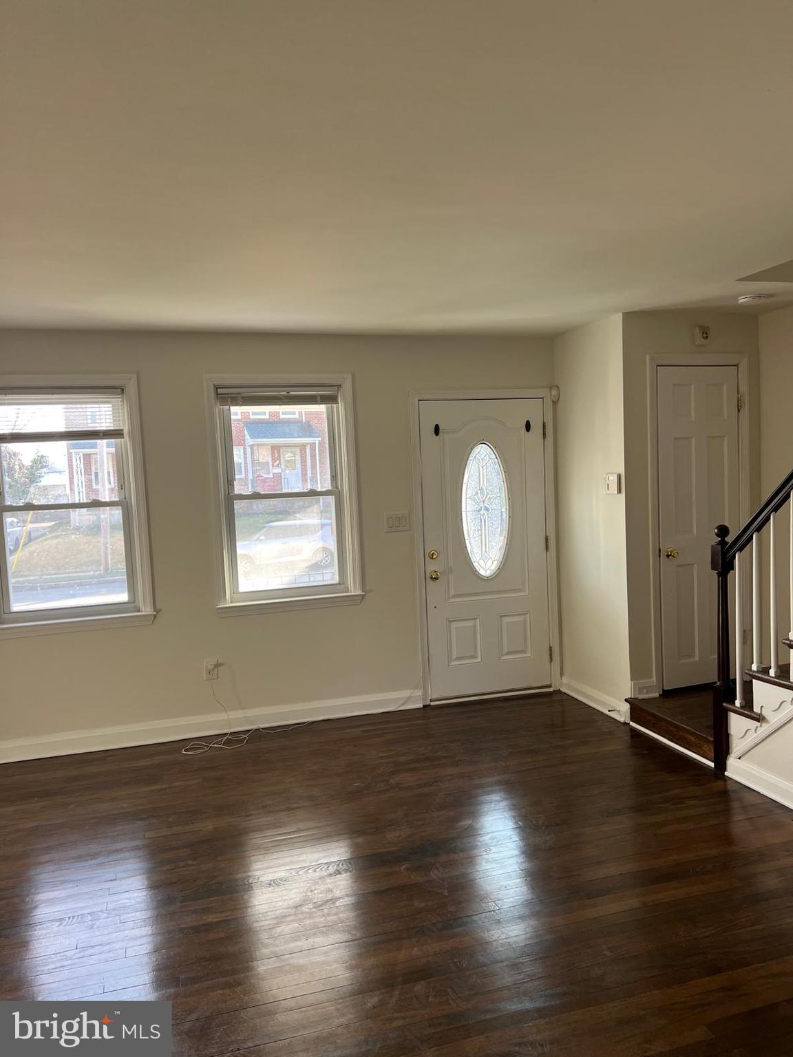 603 Braeside Road Baltimore, MD 21229 - Photo 15 of 30 an empty room with wooden floor and windows