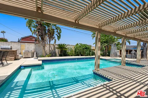 a swimming pool with wooden fence