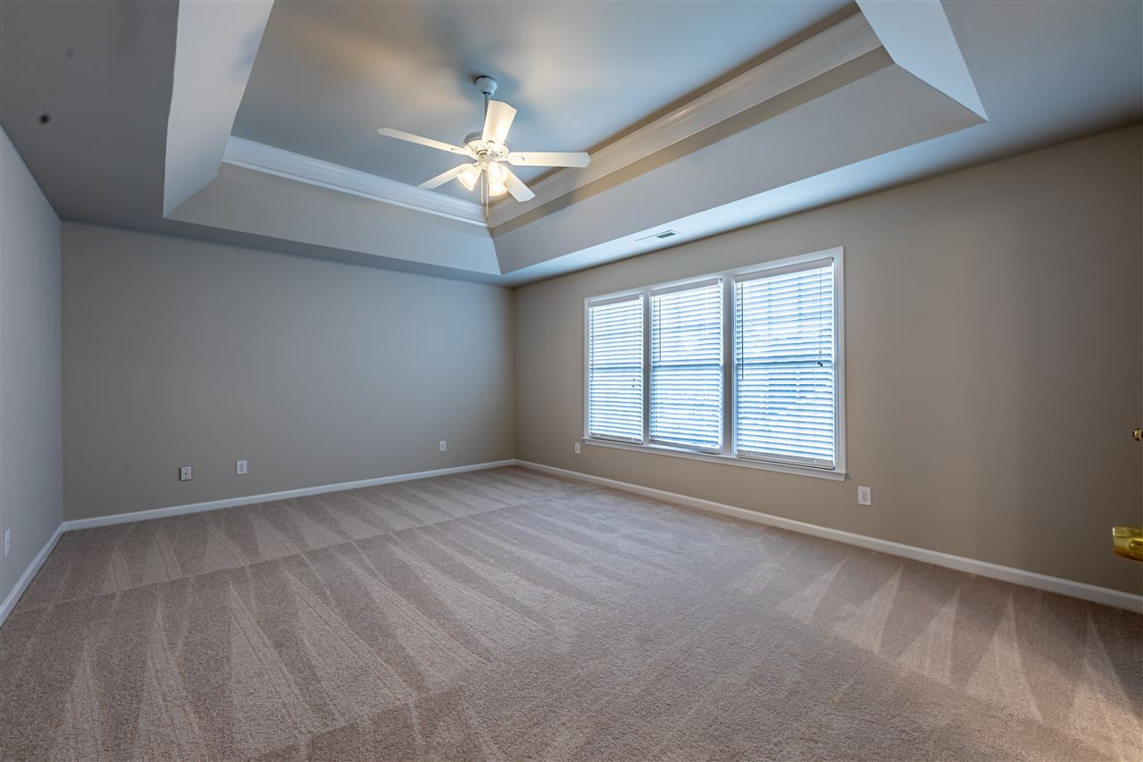 9212 Zermatt Court Raleigh, NC 27617 - Photo 14 of 30 The master bedroom features a trey ceiling and ceiling fan. Master Bedroom