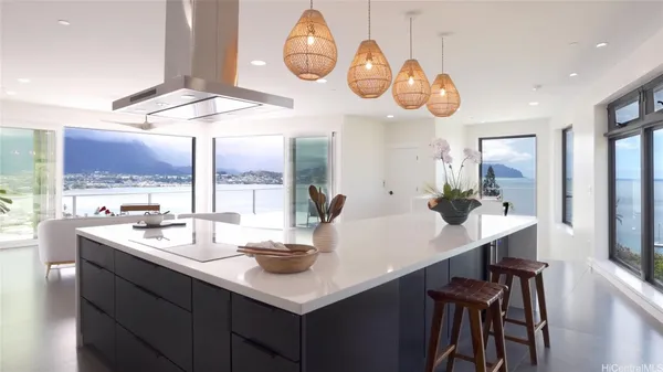 a large kitchen with stainless steel appliances lots of counter top space